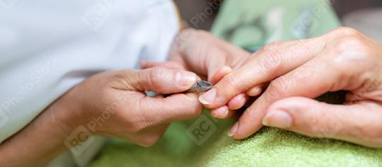 Manicurist performing a cuticle care procedure on a client in a beauty salon. body care spa treatment concept image  : Stock Photo or Stock Video Download rcfotostock photos, images and assets rcfotostock | RC Photo Stock.: