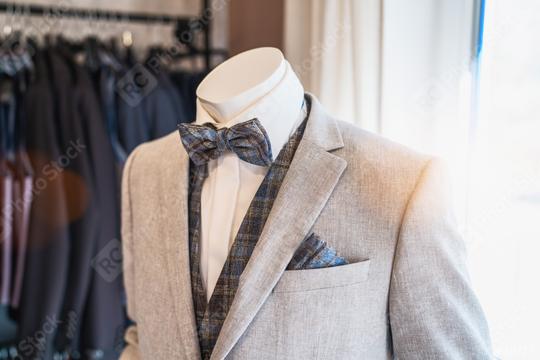 Mannequin dressed in a light gray suit with a plaid bow tie and matching pocket square  : Stock Photo or Stock Video Download rcfotostock photos, images and assets rcfotostock | RC Photo Stock.: