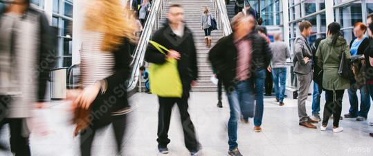 Many anonymous blurred business people traveling in the airport or at a trade fair  : Stock Photo or Stock Video Download rcfotostock photos, images and assets rcfotostock | RC Photo Stock.: