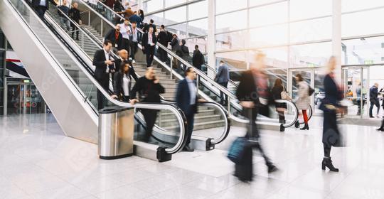 Many anonymous blurred people on escalator at trade fair or congress  : Stock Photo or Stock Video Download rcfotostock photos, images and assets rcfotostock | RC Photo Stock.: