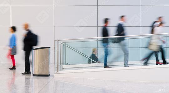 Many anonymous business people are walking through a bright corridor in the modern office  : Stock Photo or Stock Video Download rcfotostock photos, images and assets rcfotostock | RC-Photo-Stock.: