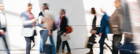 Many anonymous business people go to a business trade fair  : Stock Photo or Stock Video Download rcfotostock photos, images and assets rcfotostock | RC Photo Stock.: