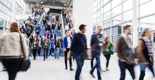 Many anonymous business people on the escalator at a business trade fair  : Stock Photo or Stock Video Download rcfotostock photos, images and assets rcfotostock | RC Photo Stock.: