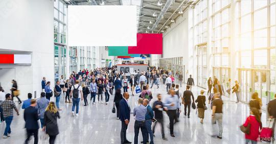 Many anonymous people are walking around advertising banner at a trade fair, copyspace for your individual text.  : Stock Photo or Stock Video Download rcfotostock photos, images and assets rcfotostock | RC Photo Stock.: