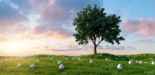 Many colorful Easter eggs lie in a meadow around a tree for Easter with dramtic sunset sky  : Stock Photo or Stock Video Download rcfotostock photos, images and assets rcfotostock | RC Photo Stock.: