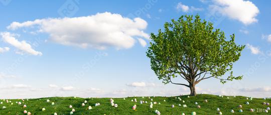 Many colorful Easter eggs lie in the grass of a meadow with tree for Easter  : Stock Photo or Stock Video Download rcfotostock photos, images and assets rcfotostock | RC Photo Stock.: