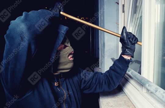 masked burglar opens a window with a crowbar  : Stock Photo or Stock Video Download rcfotostock photos, images and assets rcfotostock | RC Photo Stock.: