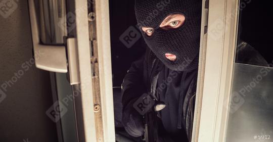 Masked burglar with gun breaking and entering into a house window - shot with dramatic motion  : Stock Photo or Stock Video Download rcfotostock photos, images and assets rcfotostock | RC Photo Stock.:
