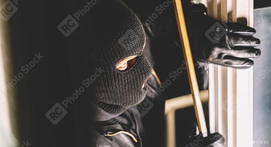 Masked burglar with torch and crowbar breaking and entering into a house  : Stock Photo or Stock Video Download rcfotostock photos, images and assets rcfotostock | RC-Photo-Stock.: