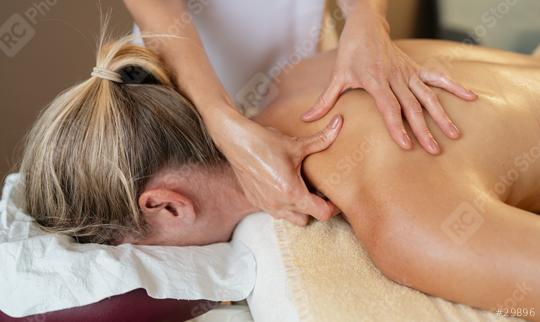 Massage therapist applying shoulder and back massage to a prone woman. beauty salon Wellness Hotel Concept image  : Stock Photo or Stock Video Download rcfotostock photos, images and assets rcfotostock | RC Photo Stock.: