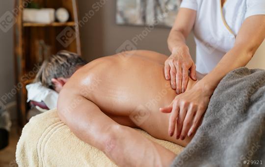 Massage therapist performing back massage on male client in spa. Wellness Hotel Concept image  : Stock Photo or Stock Video Download rcfotostock photos, images and assets rcfotostock | RC Photo Stock.: