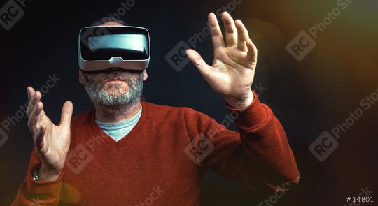 Mature business man wearing virtual reality googles / VR Glasses to work with in modern office  : Stock Photo or Stock Video Download rcfotostock photos, images and assets rcfotostock | RC Photo Stock.: