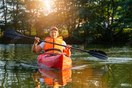 Mature man in orange life vest kayaking on a tranquil river, trees and sunlight in the background. Kayak Water Sports concept image  : Stock Photo or Stock Video Download rcfotostock photos, images and assets rcfotostock | RC Photo Stock.: