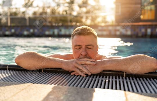 Mature man with closed eyes, resting arms on pool edge for relax  : Stock Photo or Stock Video Download rcfotostock photos, images and assets rcfotostock | RC Photo Stock.: