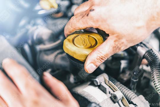 Mechanic changing oil  : Stock Photo or Stock Video Download rcfotostock photos, images and assets rcfotostock | RC Photo Stock.: