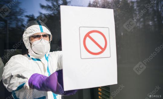 Medic seals off contaminated area during coronavirus (Coivd-19) epidemic in a clinic  : Stock Photo or Stock Video Download rcfotostock photos, images and assets rcfotostock | RC Photo Stock.: