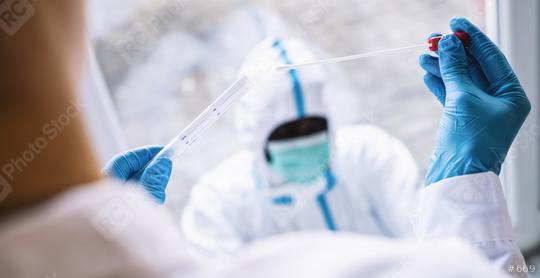 Medical professional in protective clothing takes COVID-19 swab test tube kit at Covid-19 test center during coronavirus epidemic. PCR DNA testing protocol process.  : Stock Photo or Stock Video Download rcfotostock photos, images and assets rcfotostock | RC-Photo-Stock.: