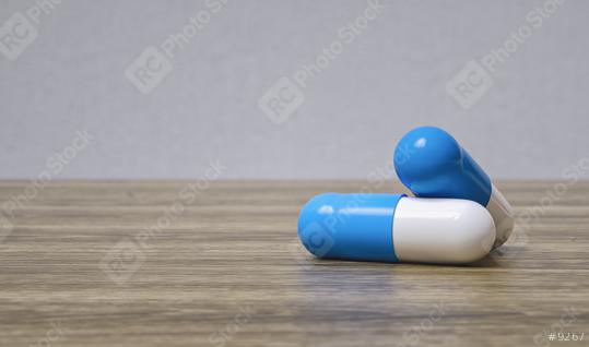 Medicine blue pills or capsules on a wooden table with copy space for individual text  : Stock Photo or Stock Video Download rcfotostock photos, images and assets rcfotostock | RC Photo Stock.: