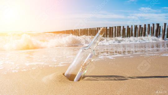 Message in a bottle on the beach with groynes  : Stock Photo or Stock Video Download rcfotostock photos, images and assets rcfotostock | RC Photo Stock.: