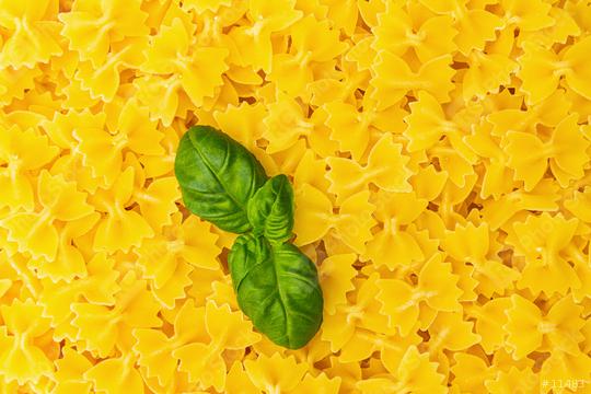 mini Farfalle noodles with basil leaf background  : Stock Photo or Stock Video Download rcfotostock photos, images and assets rcfotostock | RC Photo Stock.: