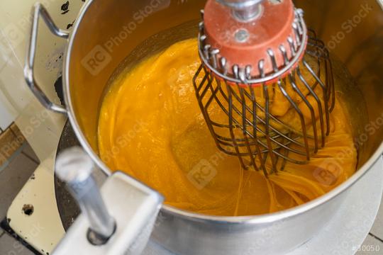 Mixing baking ingredients with egg yolks and sugar in large food mixer for cake or pancakes. Bakery shop concept.  : Stock Photo or Stock Video Download rcfotostock photos, images and assets rcfotostock | RC Photo Stock.: