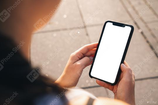 Mockup image of hand holding mobile phone with blank white screen in the city at a summer  : Stock Photo or Stock Video Download rcfotostock photos, images and assets rcfotostock | RC Photo Stock.: