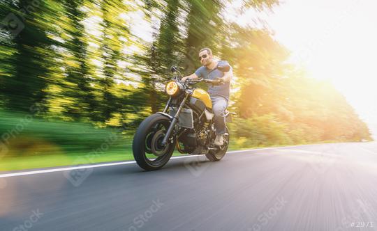 modern scrambler motorbike on the road riding a motorcycle at sunset. copyspace for your individual text.  : Stock Photo or Stock Video Download rcfotostock photos, images and assets rcfotostock | RC Photo Stock.: