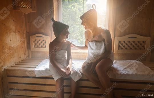 Mother and daughter enjoying a sauna session, wearing felt hats and wrapped in towels  : Stock Photo or Stock Video Download rcfotostock photos, images and assets rcfotostock | RC Photo Stock.: