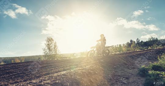 Motocross rider on a dirt track a sunset  : Stock Photo or Stock Video Download rcfotostock photos, images and assets rcfotostock | RC Photo Stock.: