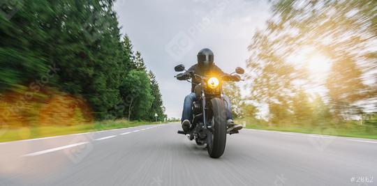 motorbike chopper on the forest road riding. having fun driving the empty road on a motorcycle tour. copyspace for your individual text.  : Stock Photo or Stock Video Download rcfotostock photos, images and assets rcfotostock | RC Photo Stock.: