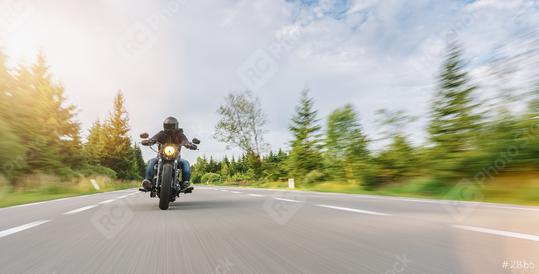 motorbike chopper on the road riding. having fun driving the empty road on a motorcycle tour. copyspace for your individual text.  : Stock Photo or Stock Video Download rcfotostock photos, images and assets rcfotostock | RC Photo Stock.: