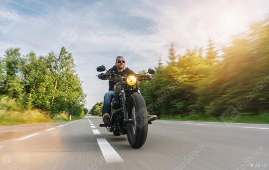 motorbike chopper on the road riding with motion speed on a motorcycle tour. copyspace for your individual text.  : Stock Photo or Stock Video Download rcfotostock photos, images and assets rcfotostock | RC Photo Stock.: