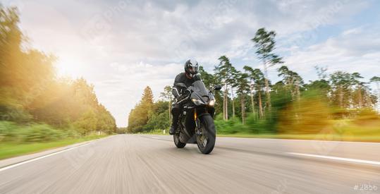 motorbike on the country road riding with motion speed. driving on the empty road on a motorcycle tour. copyspace for your individual text.  : Stock Photo or Stock Video Download rcfotostock photos, images and assets rcfotostock | RC Photo Stock.: