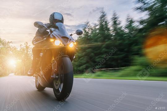 motorbike on the forest road riding at sunset. driving on the empty road on a motorcycle trip. copyspace for your individual text.  : Stock Photo or Stock Video Download rcfotostock photos, images and assets rcfotostock | RC Photo Stock.: