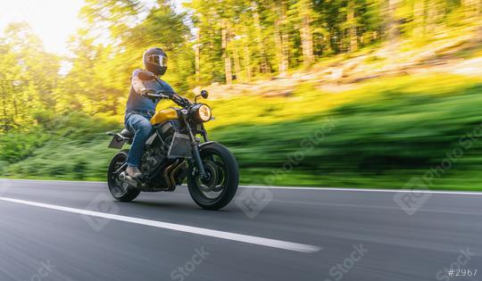 motorbike on the forest road riding at sunset. having fun driving the empty road on a motorcycle tour journey. copyspace for your individual text.  : Stock Photo or Stock Video Download rcfotostock photos, images and assets rcfotostock | RC Photo Stock.: