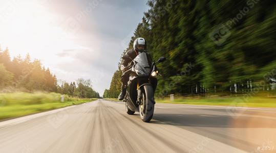 motorbike on the forest road riding. driving on the empty road on a motorcycle tour. copyspace for your individual text.  : Stock Photo or Stock Video Download rcfotostock photos, images and assets rcfotostock | RC Photo Stock.:
