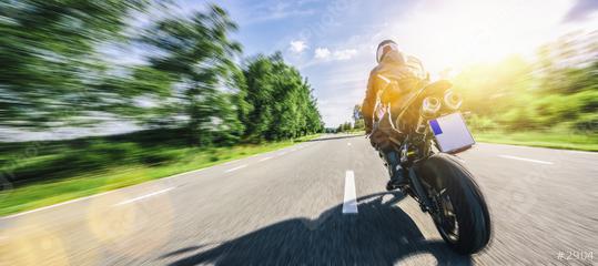motorbike on the forest road riding. having fun driving the empty road on a motorcycle tour journey. copyspace for your individual text.  : Stock Photo or Stock Video Download rcfotostock photos, images and assets rcfotostock | RC Photo Stock.: