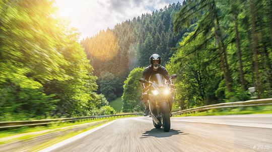 motorbike on the forest road riding. having fun driving the empty road on a motorcycle tour journey. copyspace for your individual text.   : Stock Photo or Stock Video Download rcfotostock photos, images and assets rcfotostock | RC Photo Stock.: