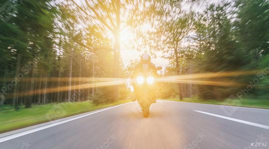 motorbike on the forest road riding with spotlights. driving on the empty road on a motorcycle tour at sunset. copyspace for your individual text.  : Stock Photo or Stock Video Download rcfotostock photos, images and assets rcfotostock | RC Photo Stock.: