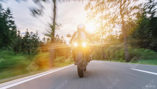 motorbike on the road riding at sunset. driving on the empty road on a motorcycle trip. copyspace for your individual text.  : Stock Photo or Stock Video Download rcfotostock photos, images and assets rcfotostock | RC Photo Stock.: