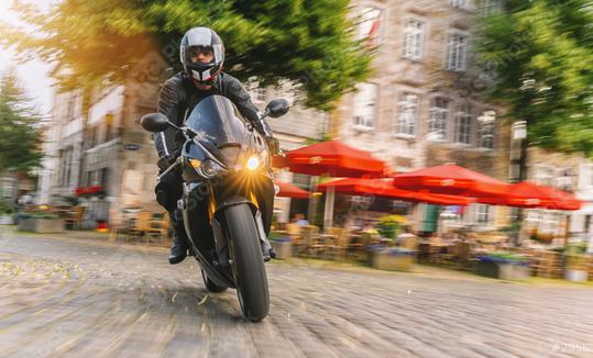 motorbike riding at a town road. driving on road on a motorcycle tour at summer  : Stock Photo or Stock Video Download rcfotostock photos, images and assets rcfotostock | RC Photo Stock.: