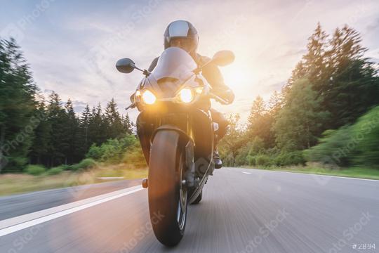 motorbike riding at sunset driving on the empty road on a motorcycle trip. copyspace for your individual text.  : Stock Photo or Stock Video Download rcfotostock photos, images and assets rcfotostock | RC Photo Stock.: