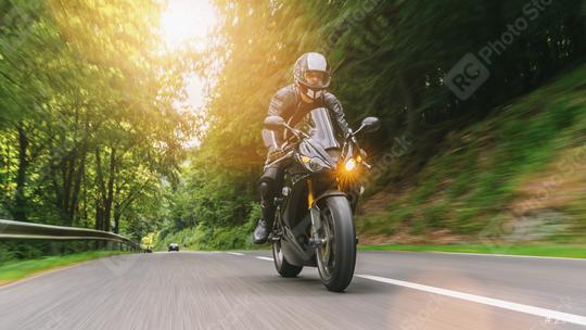motorbike riding on the forest road. driving on the empty road on a motorcycle tour. copyspace for your individual text.  : Stock Photo or Stock Video Download rcfotostock photos, images and assets rcfotostock | RC Photo Stock.: