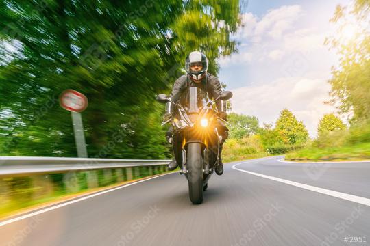 motorbike riding on the road with traffic sign. driving on the empty road on a motorcycle tour  : Stock Photo or Stock Video Download rcfotostock photos, images and assets rcfotostock | RC Photo Stock.: