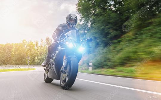 motorbiker on the forest road riding. having fun driving the empty road on a motorcycle tour journey. copyspace for your individual text.  : Stock Photo or Stock Video Download rcfotostock photos, images and assets rcfotostock | RC Photo Stock.: