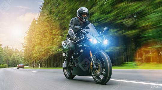 motorbiker on the forest road riding. having fun driving the empty road on a motorcycle tour journey  : Stock Photo or Stock Video Download rcfotostock photos, images and assets rcfotostock | RC Photo Stock.: