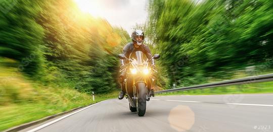 motorcycle driving on empty road at sunset. adventure freedom of single driver motorbike on highway. copy space for individual text on the right.  : Stock Photo or Stock Video Download rcfotostock photos, images and assets rcfotostock | RC Photo Stock.: