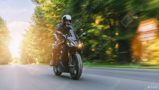motorcycle riding on the forest road at summer. driving on the empty road on a motorbike trip. copyspace for your individual text.  : Stock Photo or Stock Video Download rcfotostock photos, images and assets rcfotostock | RC Photo Stock.:
