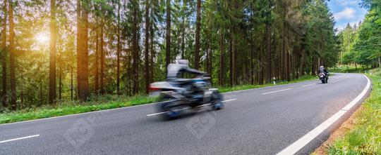 motorcycles on the forest road riding fast. having fun driving the empty road on a motorcycle tour journey. copyspace for your individual text.  : Stock Photo or Stock Video Download rcfotostock photos, images and assets rcfotostock | RC Photo Stock.: