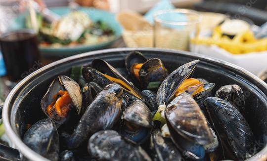 Mussels in a bowl with French fries on a restaurant.  A classic dish in Belgium, France and Netherlands.   : Stock Photo or Stock Video Download rcfotostock photos, images and assets rcfotostock | RC Photo Stock.: